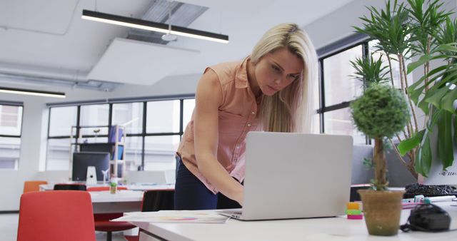 Young Professional Woman Working in Modern Office - Download Free Stock Images Pikwizard.com