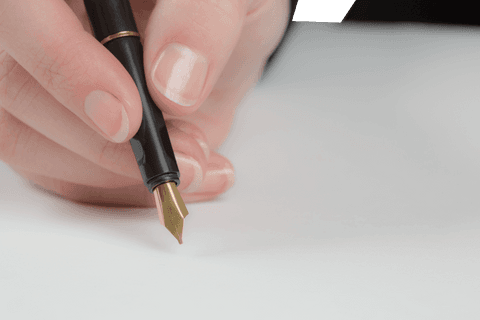 woman's hand writing with gold-tipped fountain pen on transparent background - Download Free Stock Videos Pikwizard.com