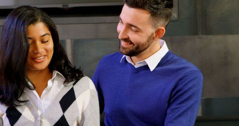 Smiling diverse colleagues having friendly conversation