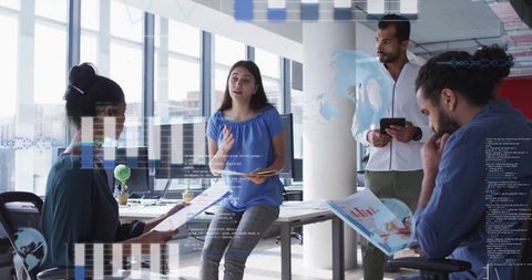 Creative Team Working with Financial Data in Modern Office