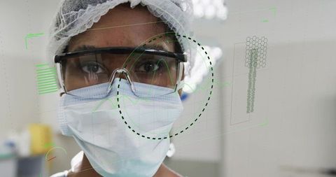 Clinician wearing protective gear with futuristic ar holographic medical interface