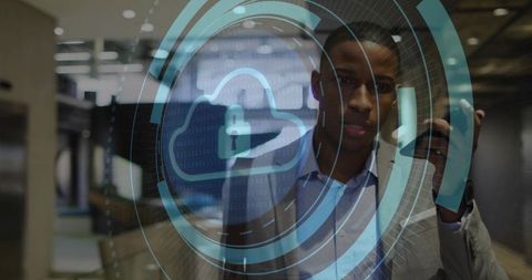 Businessman analyzing cloud security interface in modern office