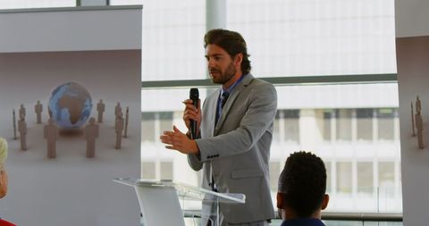 Confident Business Speaker at Seminar Podium