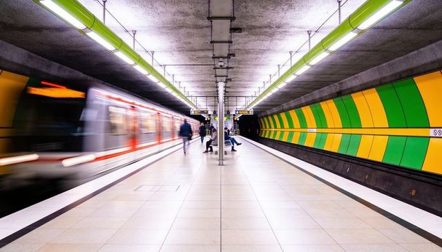 Underground metro platform with blurred train motion and central symmetry