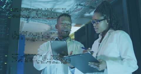 African American Professionals Analyzing Server Data with Digital Overlay