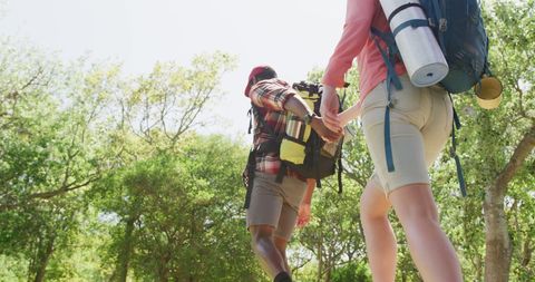 Diverse Couple Hiking Holding Hands in Forest Park - Download Free Stock Images Pikwizard.com
