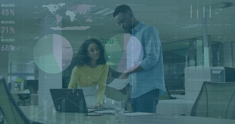 Professionals Analyzing Data and Reports in Modern Office Environment