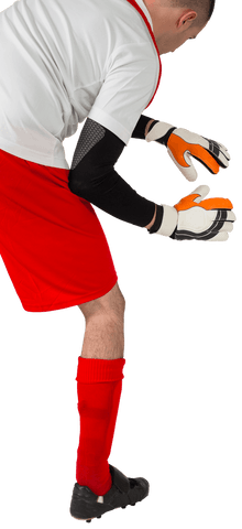 Transparent goalkeeper in red and white gear ready to save
