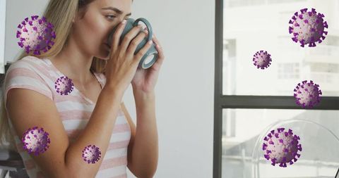 Young Woman Drinking Coffee Enhanced with Illustrated Covid Cells