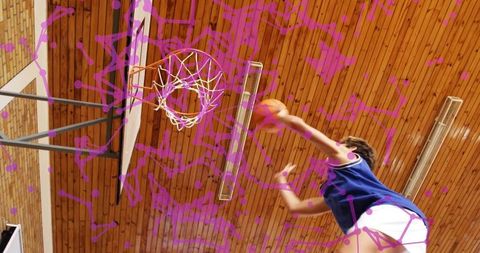 Energetic Teen Shooting Basketball in Gym