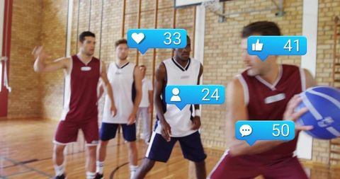 Basketball players passing and defending in gym with social media engagement icons overlay