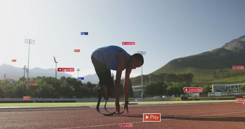 Athlete with Prosthetic Leg Preparing on Track Surrounded by Social Media Elements