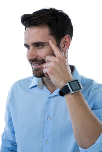 Man in casual shirt smiling and pointing to his head with finger, suggesting an idea or thought. Wearing a smartwatch, he appears confident and thoughtful. Perfect for concepts related to thinking, ideas, innovation, and technology.