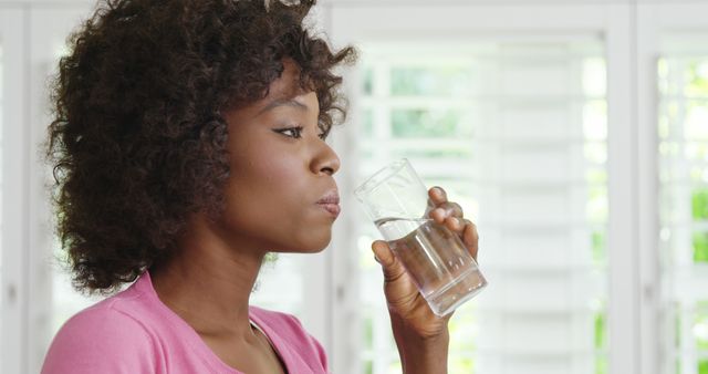 Woman Drinking Water at Home for Refreshment - Download Free Stock Images Pikwizard.com