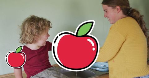 Mother and Son Enjoying Time in Kitchen with Apple Icons