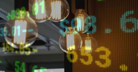 Glowing edison bulb cluster hanging in industrial cafe showing stock ticker digits overlay