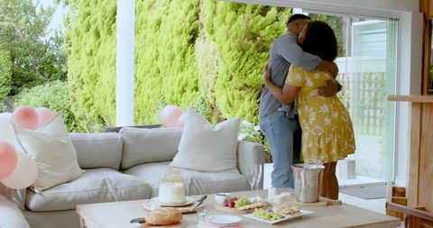 Couple embracing on patio during celebratory occasion