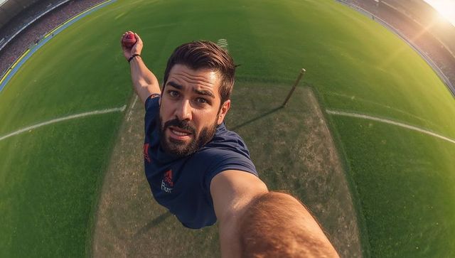 Energetic Cricketer Taking Selfie on Vibrant Stadium Pitch