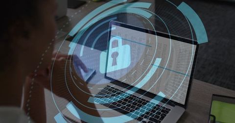 Woman Working on Laptop with Holographic Padlock Overlay Representing Data Encryption