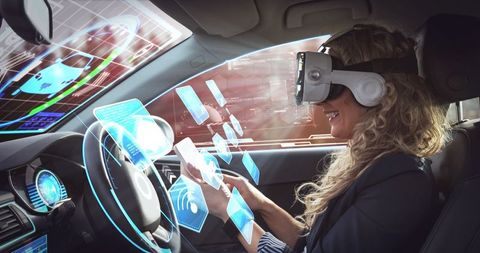 Woman in self-driving car using virtual reality technology