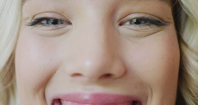 Close-up of smiling woman with bright eyes and blonde hair - Download Free Stock Images Pikwizard.com