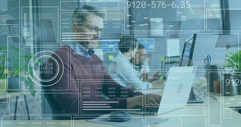 Businessman Analyzing Data Interfaces in Modern Workspace