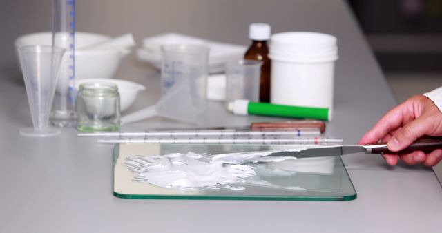 Scientists Hand Mixing Compound with Lab Equipment on Desk - Download Free Stock Images Pikwizard.com