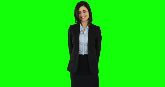 Professional Woman in Business Suit Standing Against Green Background - Download Free Stock Images Pikwizard.com