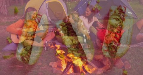 Friends Camping with Guitar and Campfire Under the Trees