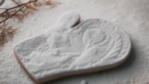 Mitten-Shaped Sugar Cookie on Powdered Surface