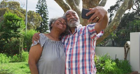 Senior African American Couple Taking Selfie in Sunny Garden - Download Free Stock Images Pikwizard.com
