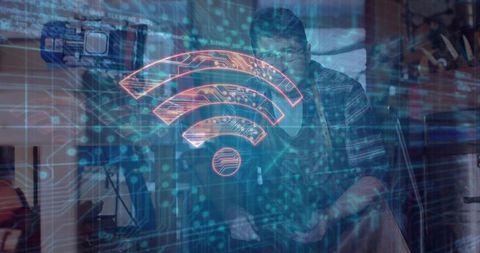 Craftsman using technology in workshop enhancing woodwork