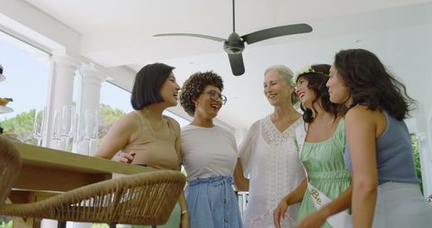 Diverse Women Engaging in Pre-Wedding Celebration Indoors