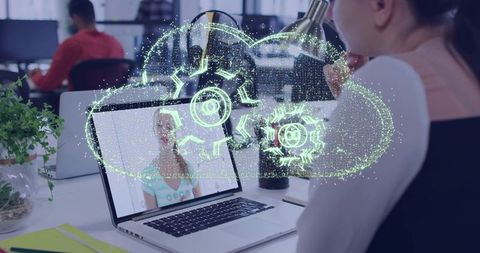 Woman Viewing Laptop with Cloud Gears Hologram Representing Remote Collaboration Automation