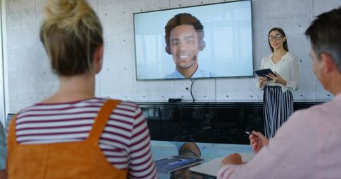 Businesswoman Leading Video Conference Presentation