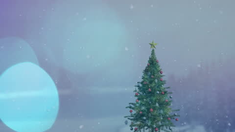 Beautifully Decorated Christmas Tree with Falling Snow