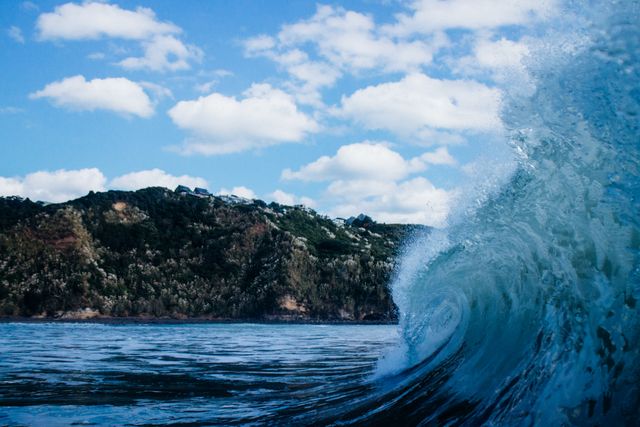 Ocean Wave Crashing Near Scenic Coastline on Sunny Day - Download Free Stock Photos Pikwizard.com