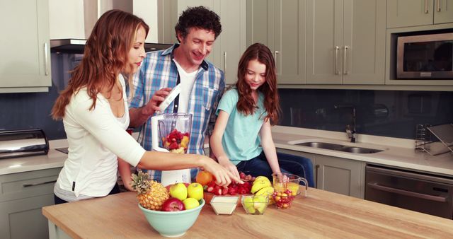 Happy Family Preparing Healthy Smoothie Together in Modern Kitchen - Download Free Stock Images Pikwizard.com