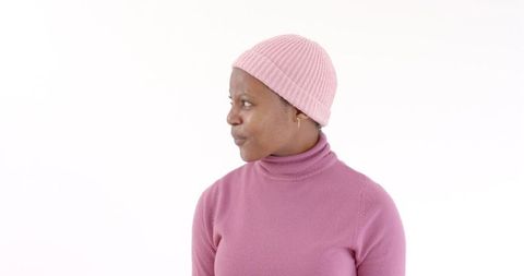 Cheerful Woman in Pink Outfit Embracing Winter Fashion