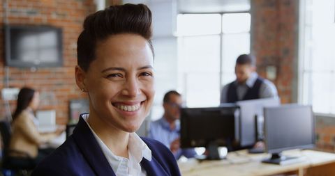 Confident Businesswoman Enjoys Productive Office Environment