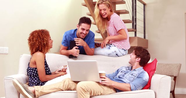 Happy Friends Laughing Around Laptop in Cozy Living Room - Download Free Stock Images Pikwizard.com