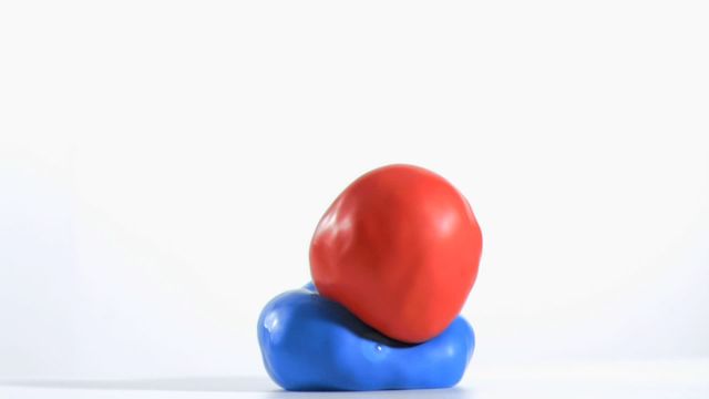 This playful and dynamic depiction of a red balloon slowly bouncing off a blue one with a crisp white backdrop captures a sense of whimsy and liveliness. Perfect for representing concepts of energy, resilience, or scientific study, this vibrant creation can be used in educational settings, promotional materials for parties or creative events, and playful product advertisements.