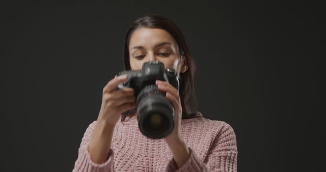 Female Photographer Adjusting the Camera Settings During Photoshoot - Download Free Stock Images Pikwizard.com