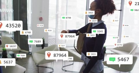 Businesswoman walking in office with technology overlay