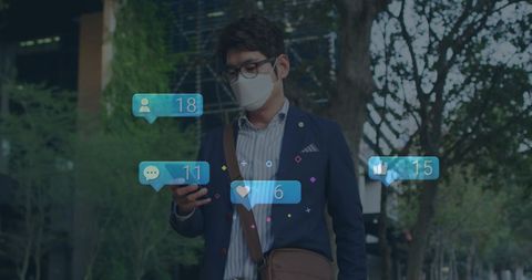 Businessman Receives Social Media Notifications Outdoors