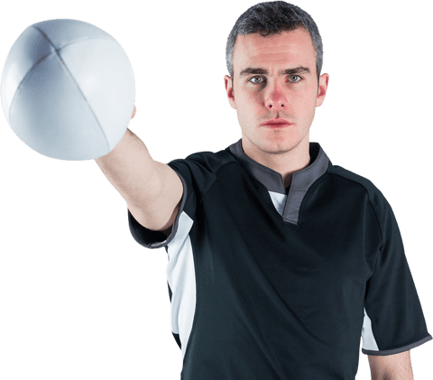 Rugby player with determined expression holding rugby ball transparent background