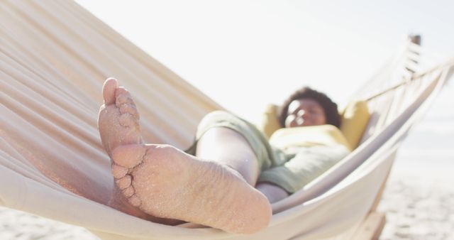 Relaxed Person Lounging in Hammock on Beach - Download Free Stock Images Pikwizard.com
