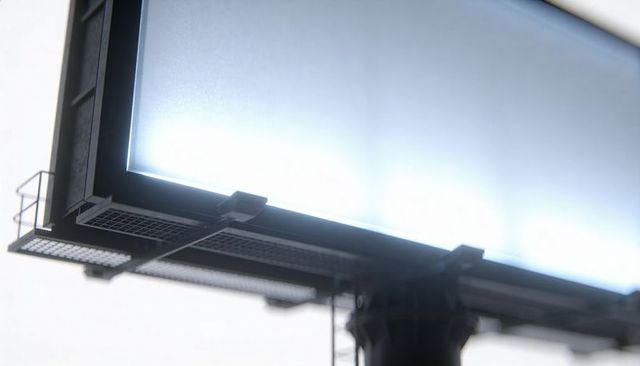 Blank backlit billboard panel dominating frame with metal catwalk and ladder