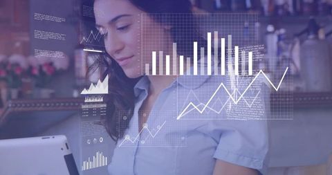 Young Woman Analyzing Digital Data on Tablet in Coffee Shop