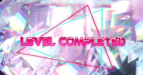 Level completed text on glowing crystal background